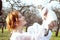 Girl holding a white ferret