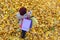 Girl holds back for shopping bags and walks in autumn Park. Top view