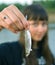 Girl holds the first caught fish in a hand