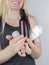 Girl holds in her hands three eco-friendly antiperspirants with natural ingredients. Refusal of antiperspirants containing toxic