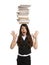 The girl holds pile of books on head