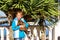 Girl holds of raccoon. Sochi seaport, Russia