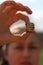 Girl holds stacked british coins by pound