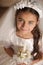 Girl in Holy Communion Dress with candle