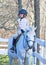 Girl at horseback riding lesson.