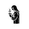 Girl with hot drink in mug black glyph icon