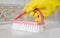 Girl hotel worker with cleaning products doing cleaning in the bathroom with a rag