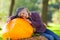 Girl with huge pumpkin