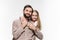 Girl hugging her father over a white background