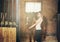 Girl hugging a horse in a stable at the ranch