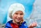 Girl with ice piece near Nigardsbreen glacier (Norway)