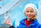 Girl with ice piece near Nigardsbreen glacier (Norway)