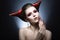 The girl in an image of the demon-tempter with long nails and haircut in the form of horns.