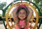 Girl inside climbing frame