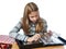 Girl inspecting her collection coins isolated