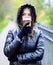 Girl in jacket with hood, holding a coffee or tea, young enjoys the outdoors and sports, spring autumn, lifestyle, blac