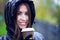 Girl in jacket with hood, holding a coffee or tea, young enjoys the outdoors and sports, spring autumn, lifestyle, blac