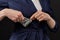 Girl in a jacket removes US dollars on a black background