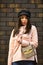 Girl jacket urban style. Female psychology. Fashion outfit. Little purse. Matching style and class with luxury and