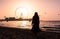 Girl on the JBR beach with Ain Dubai ferris wheel