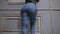 Girl in jeans with leather garter new fashion trends. straps on the hips