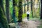 Girl jogging in forest sunset spring