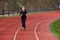 Girl Jogging in a Stadium