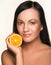 Girl with juicy orange