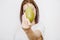 Girl with juicy pear. Young woman with fruit in her hands.