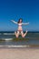 Girl jumping on beach