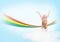 Girl jumping on clouds and a rainbow