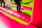 Girl jumping and exercising while having fun in an inflatable castle to bounce