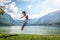 Girl jumping on the lake