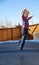 Girl jumping on trampoline