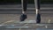 Girl jumps down a hopscotch court like a child