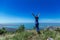 Girl jumps on the slope of a ridge.  Late spring early summer Gelendzhik