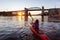 Girl Kayaking in a Modern City