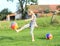 Girl kicking inflating balls