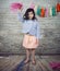 Girl kid at birthday party holding a pom pom