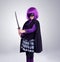 Girl kid, costume and sword in studio portrait for vigilante fantasy, creative and comic aesthetic. Child, superhero