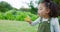 Girl kids blowing bubbles in park, garden and backyard, nature and environment of fun, joy and happy childhood