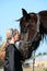 Girl kissing her pony