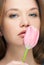 Girl kissing tulip portrait