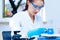 Girl laboratory assistant checks samples medical lab
