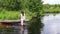 Girl on lake log relaxing