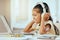 Girl, laptop and headphones with smile, music or video on desk in homeschool, learning and education, Child, computer