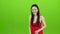 Girl laughing loudly at her beautiful smile. Green screen. Slow motion