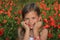 Girl laughing in a poppy field