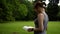 Girl leafing through a book in nature day