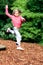 Girl leaps high in playground